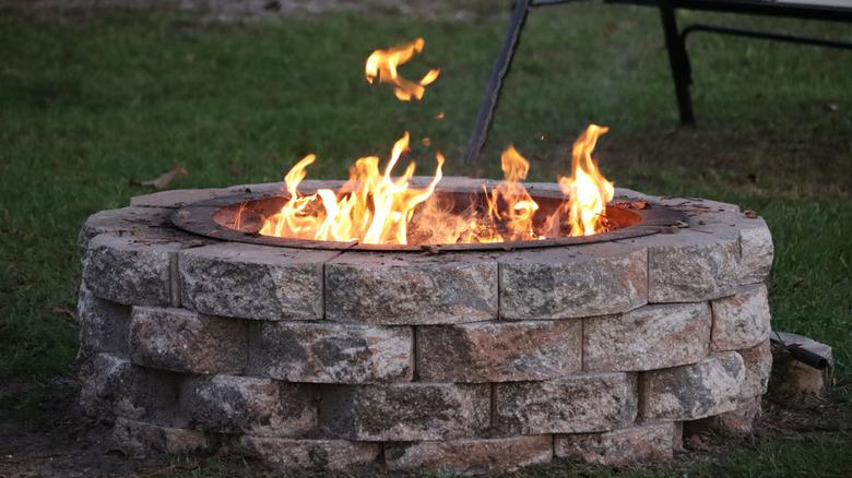 Fire pit made of stacked stone bricks