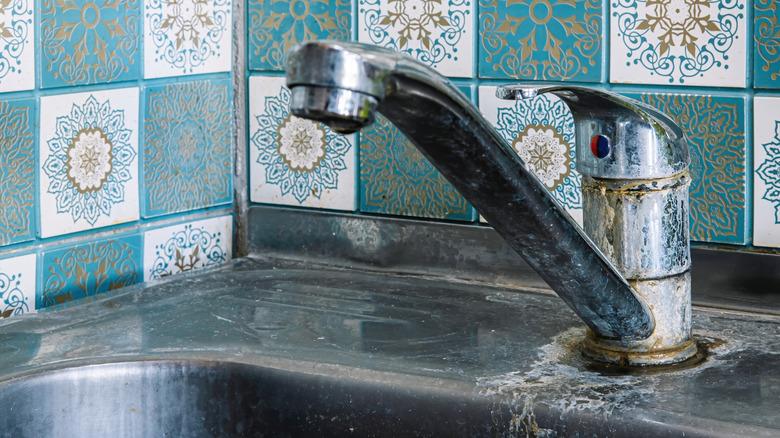 A rusty and corroded faucet