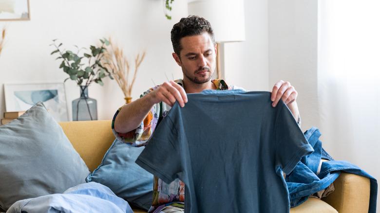 Man folding his laundry