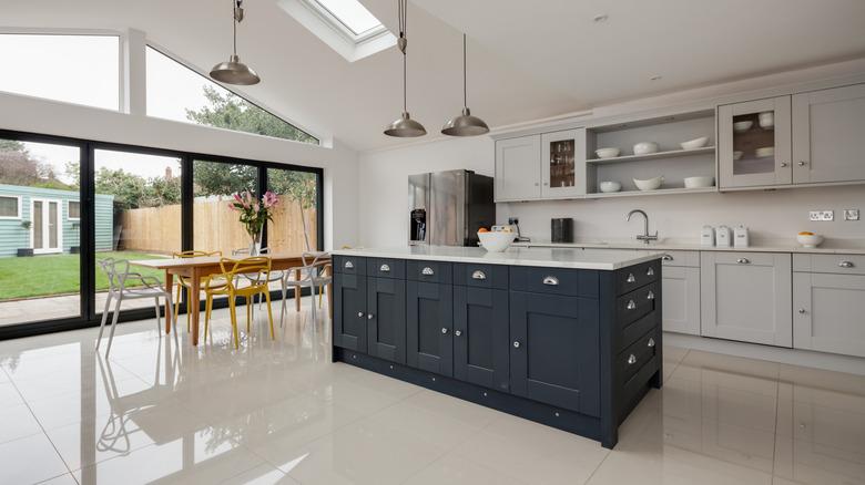 modern white kitchen navy island