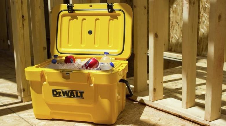 Cans and bottles in DeWalt cooler on construction site