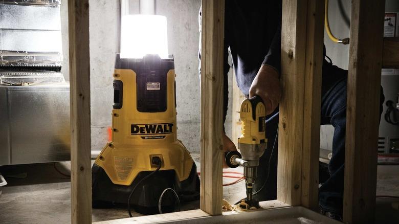 DeWalt LED area light illuminating a framing operation