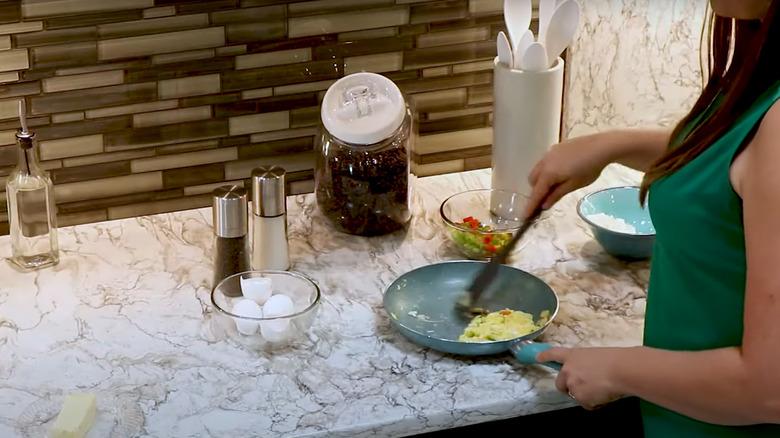 Woman cooking on Invisacook counter