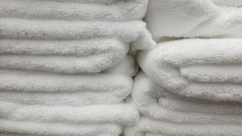 Close-up photo of folded white bath towels