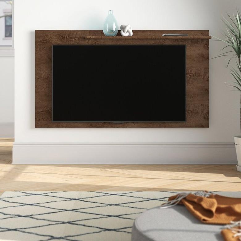 Flat screen on wall mount, rug