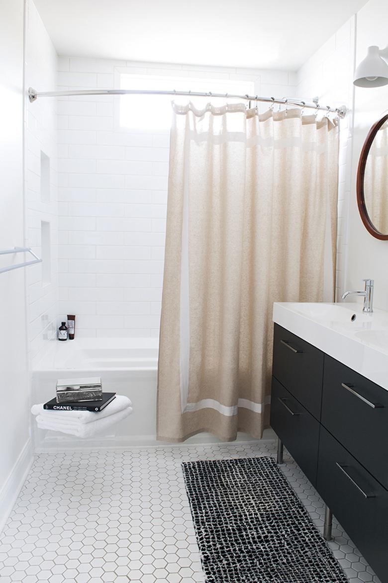 white bathroom with neutral shower curtain