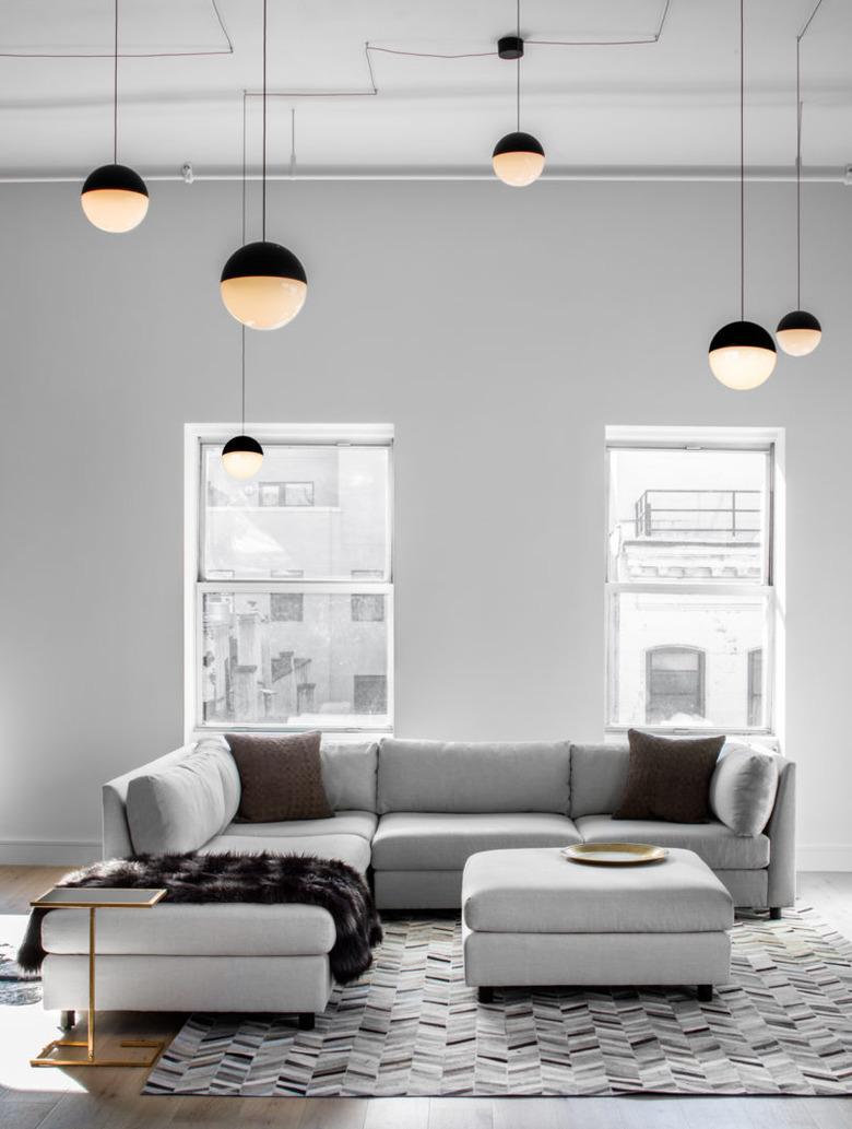 living room with suspension pendant lighting