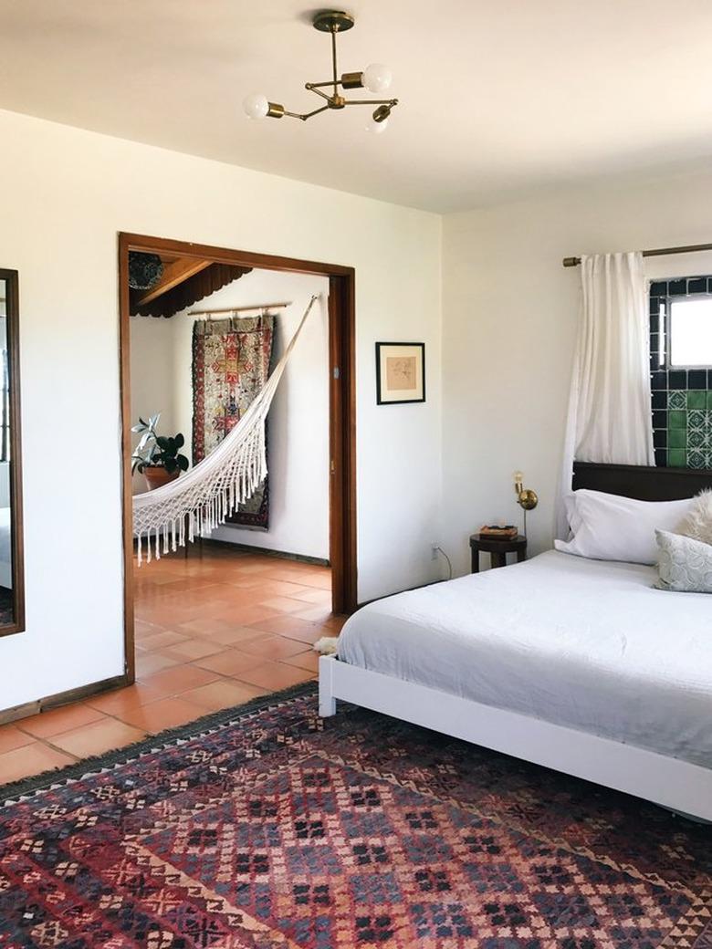 the Joshua Tree house bedroom with modern furnishings and original tile details