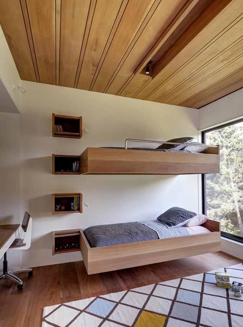 midcentury bedroom with floating bunk beds and wood ceiling