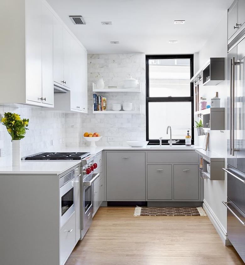 bright modern kitchen with black window frame and white marble