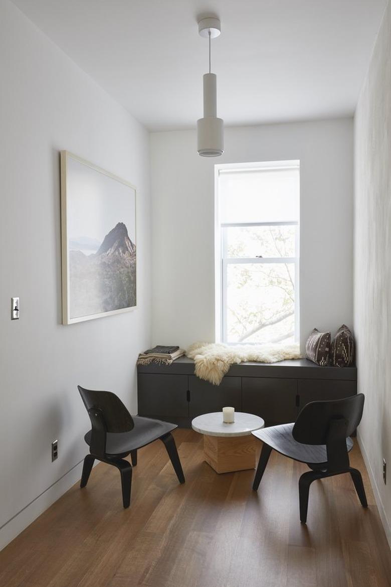 seating area with Eames chairs and built-in bench