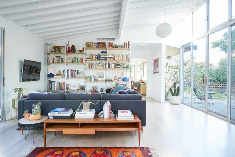 light, bright midcentury living room interior with vintage furniture