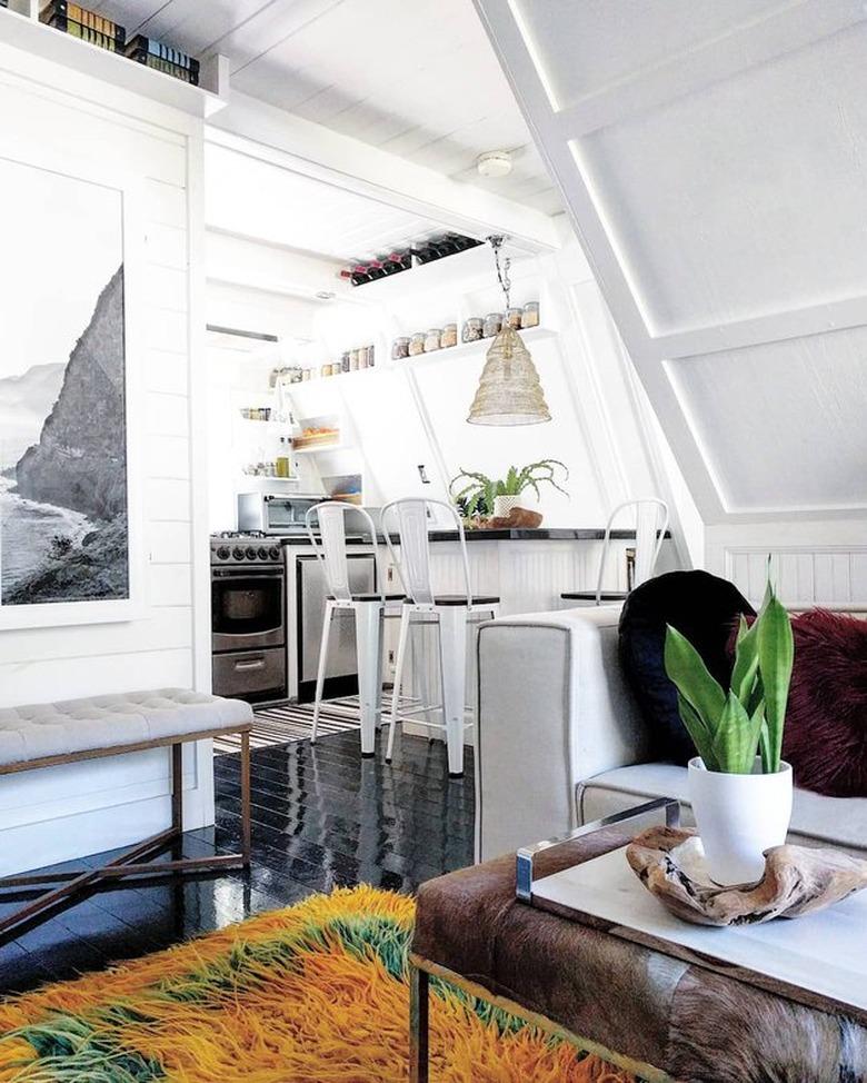 A-frame cabin with eclectic black-and-white furnishings