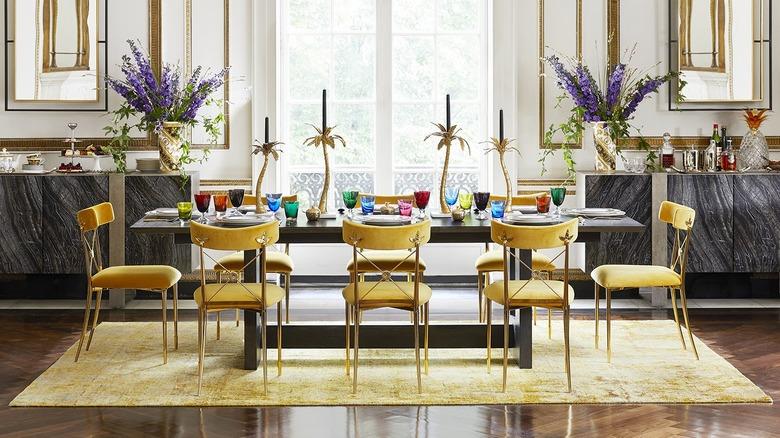 colorful traditional and modern dining room with yellow chairs