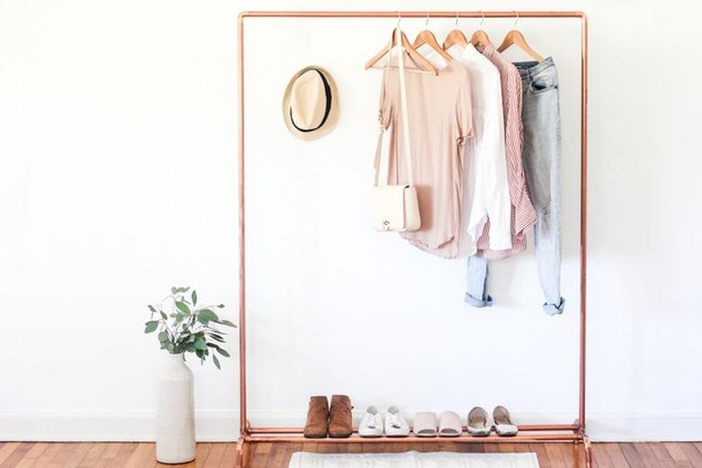 DIY storage ideas for small bedrooms with copper clothing rack