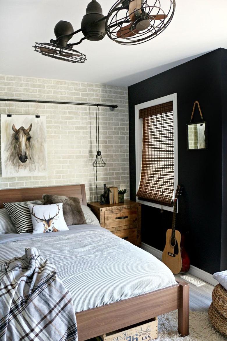 industrial bedroom with black wall and rustic accents