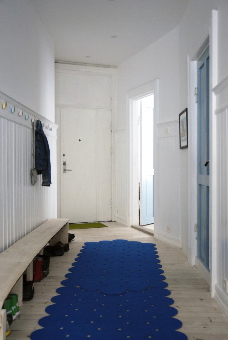 narrow hallway with wood floors