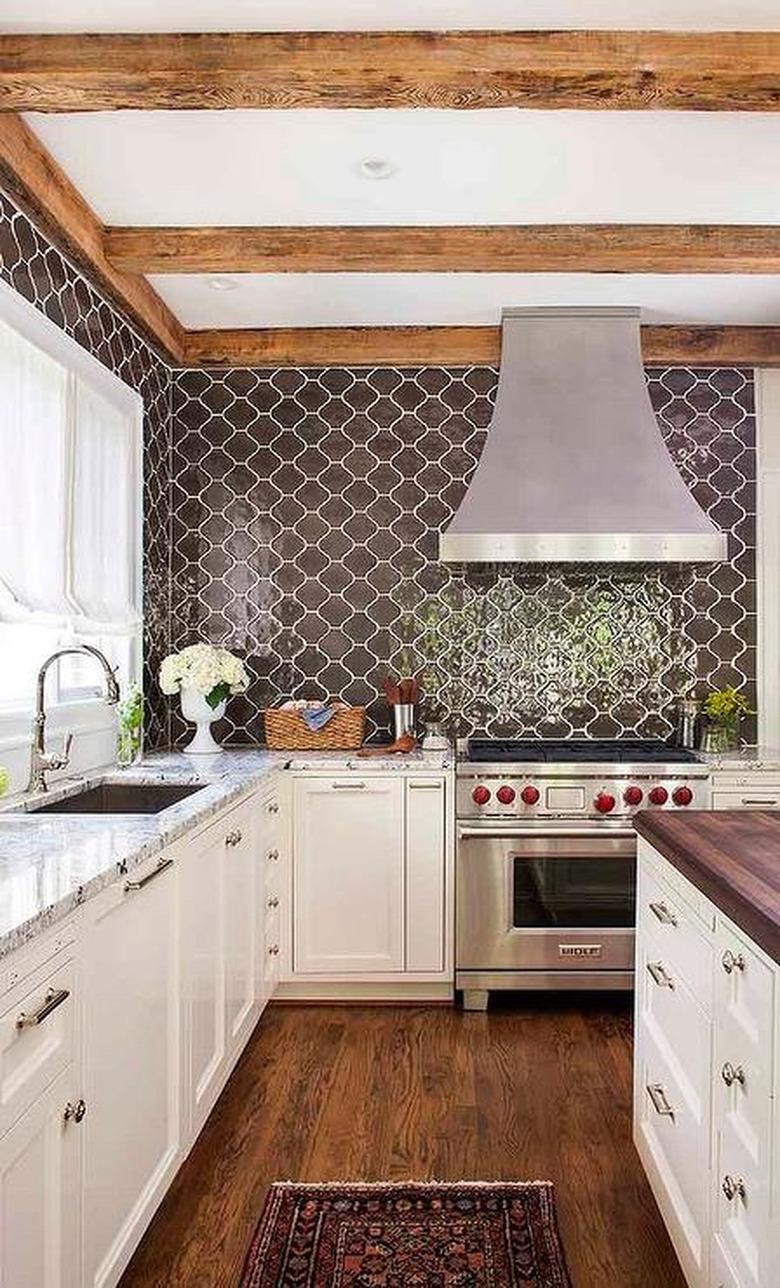 rustic kitchen with brown arabesque tile backsplash