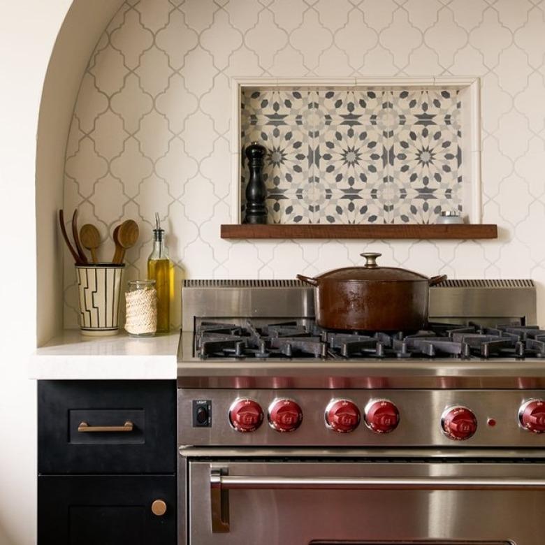 kitchen with arabesque tile backsplash behind stove