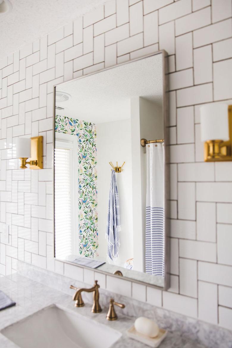 Bathroom with 90-degree herringbone pattern art deco tile on wall