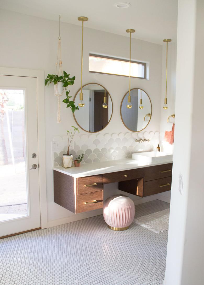 Scalloped art deco tile backsplash in white and gray in art deco bathroom