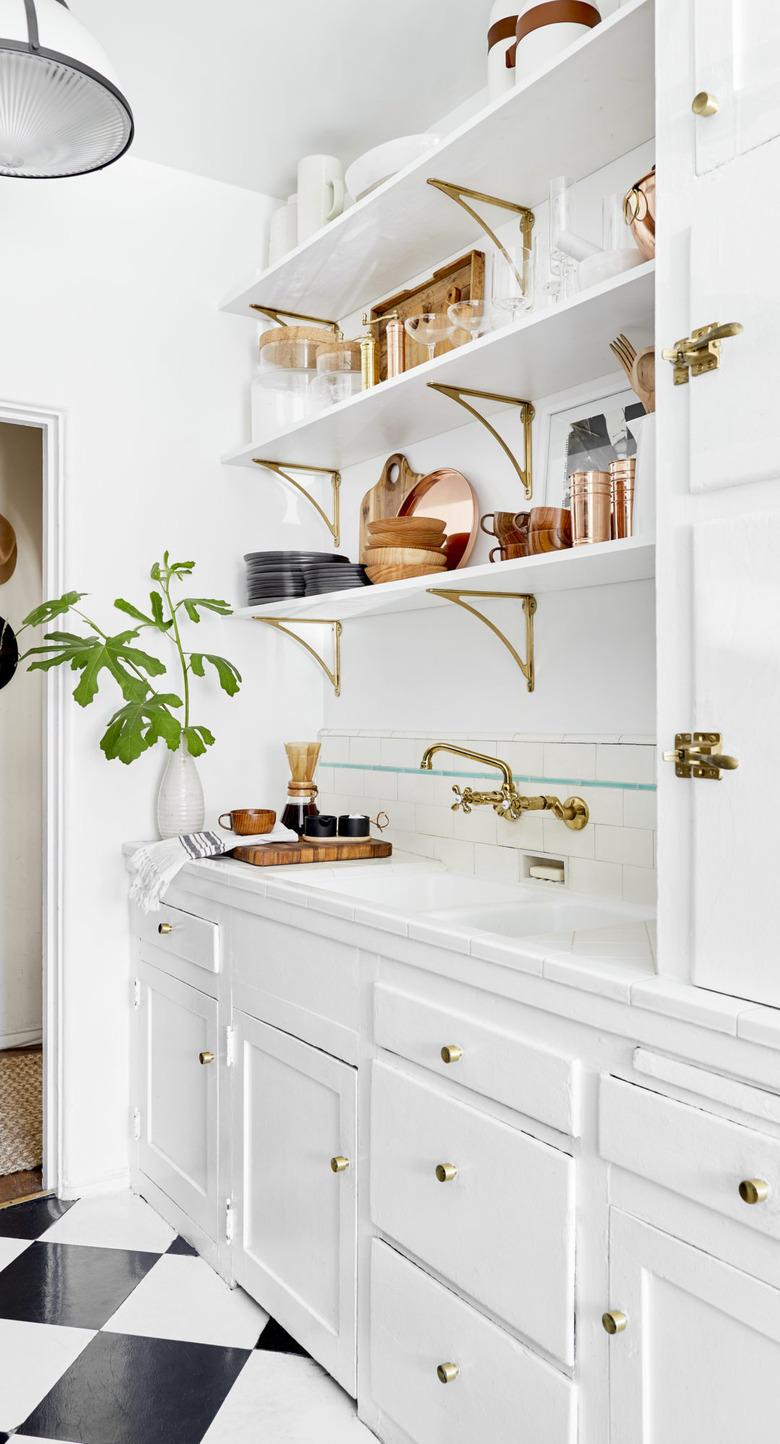 arts and crafts interior with white kitchen with floating shelves