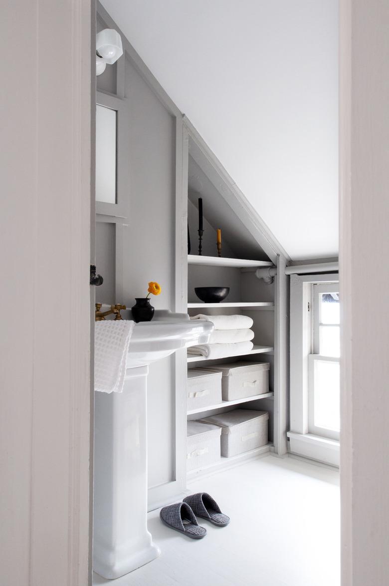 Attic Closet ideas in bathroom with towel storage