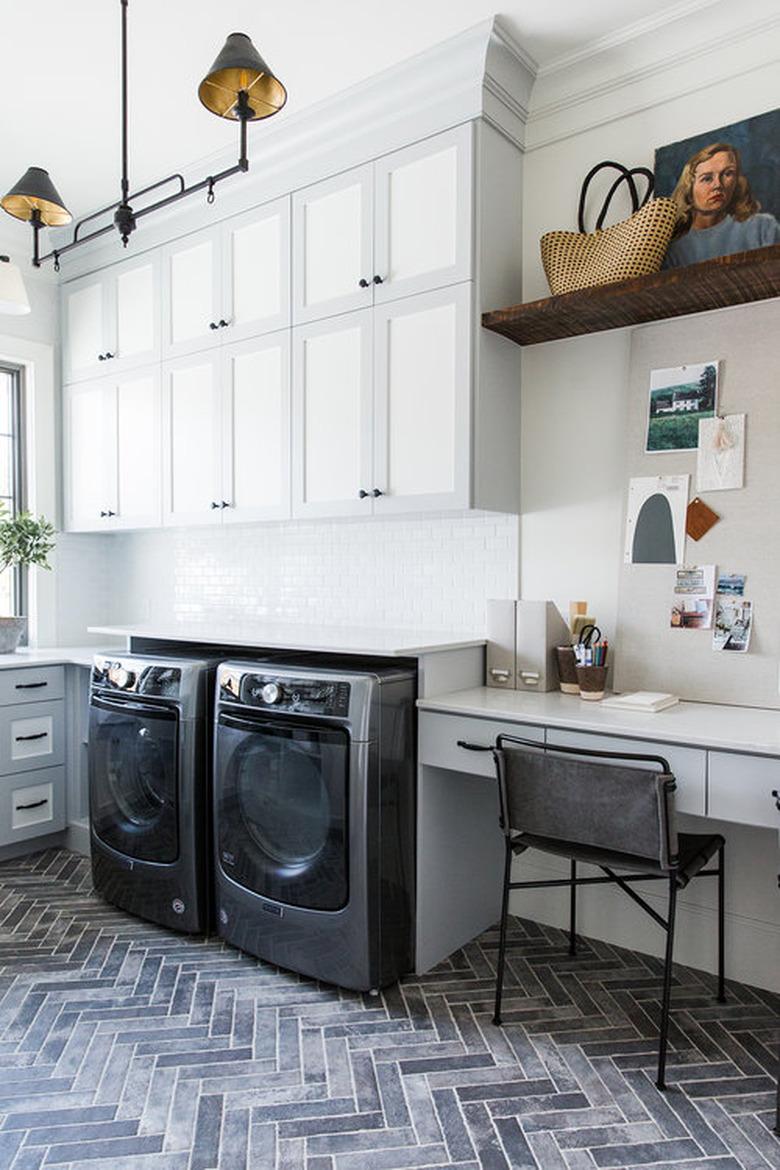 basement laundry room ideas hexagon pattern brick floor and black ceiling light in