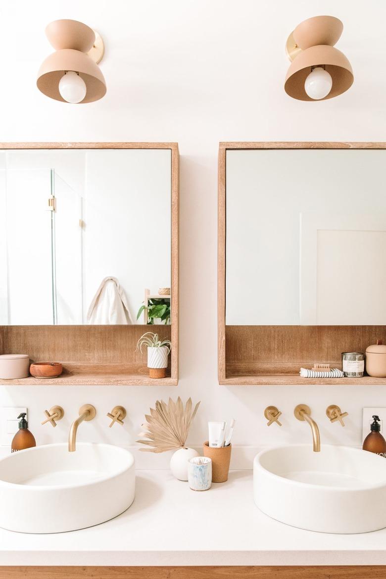 white quartz bathroom countertops with vessel sinks and wall-mounted faucets and wood details