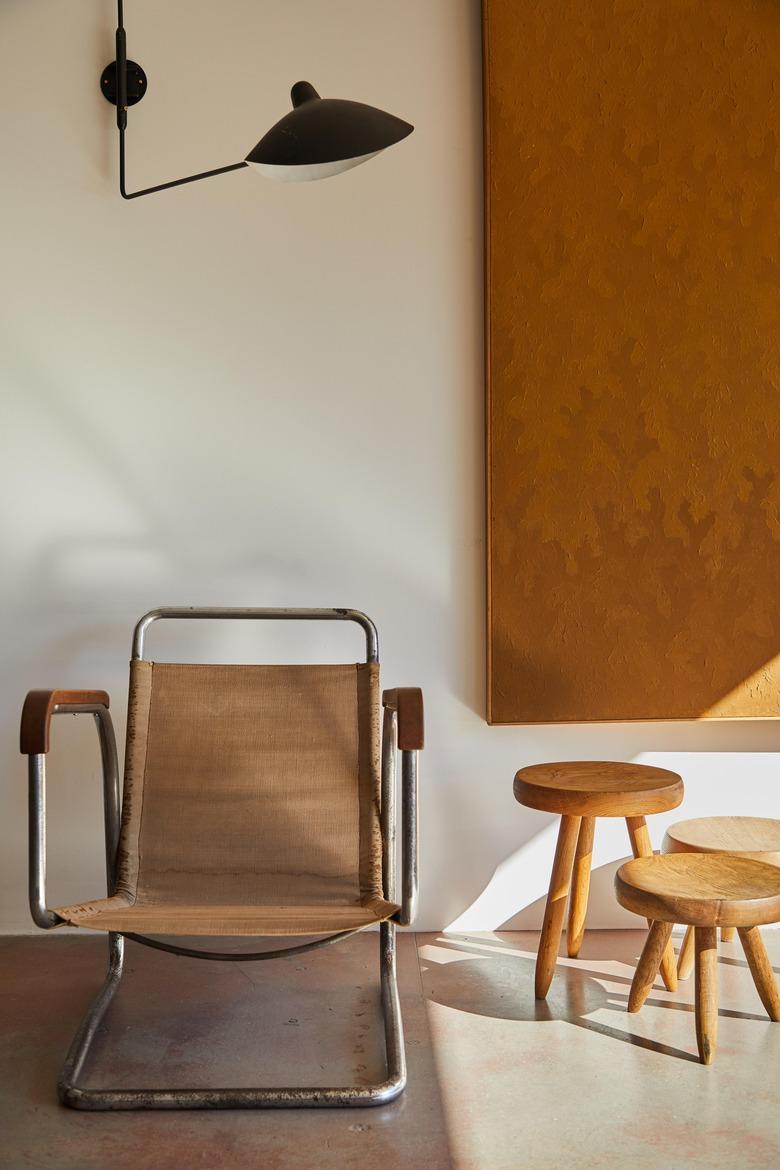 Bauhaus style room with modern wall sconce and Bauhaus chair