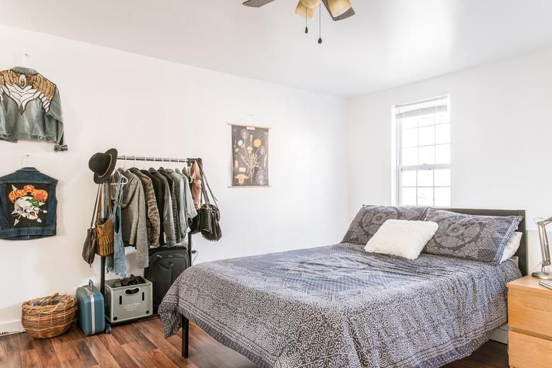 Boho bed with standing clothing rack