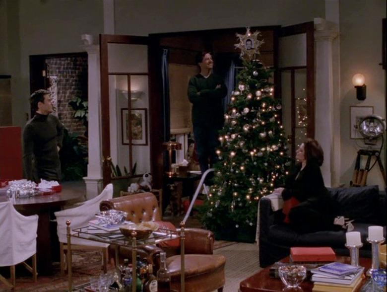 scene from Will & Grace showing figures around a Christmas tree