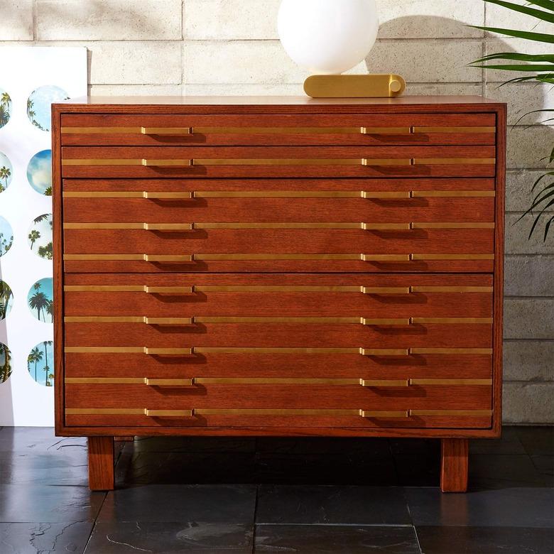 oak file cabinet with inlaid brass in modern space