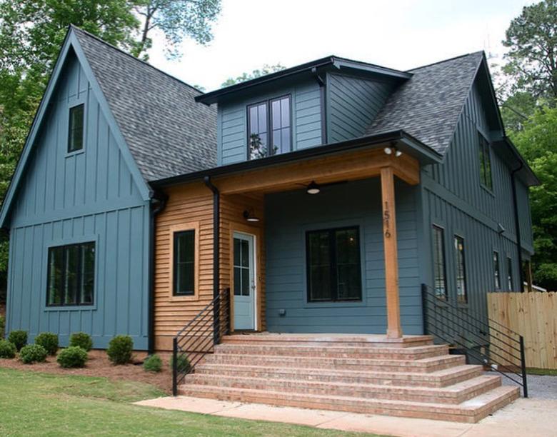 teal blue home exterior with wood trim and brick steps