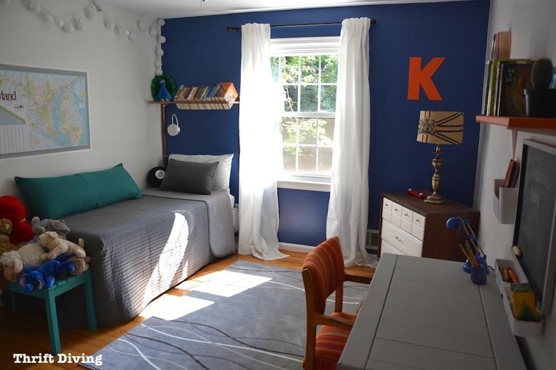 blue accent wall in bedroom