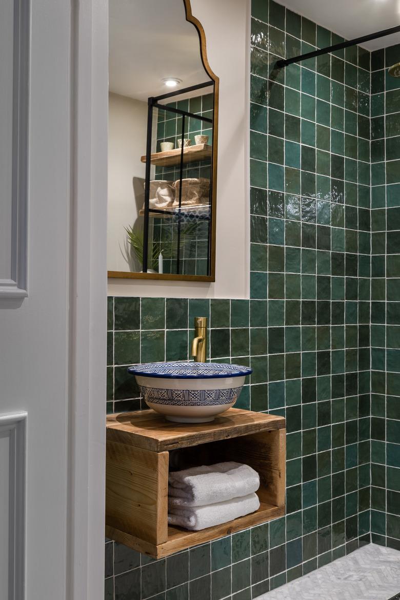 Brass Bathroom Faucet in Moroccan style bathroom with unique sink and brass tap