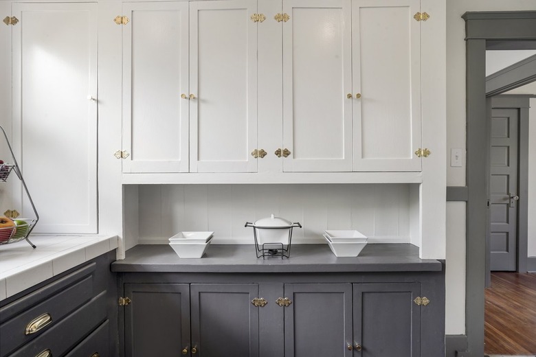 Kitchen with gray and white cabinets.