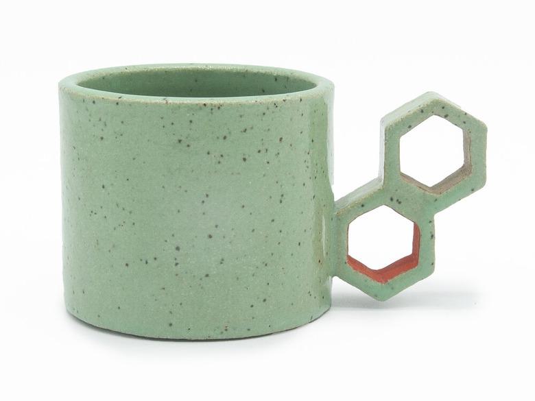 Mint-green ceramic mug with beehive inspired handle by Eunbi