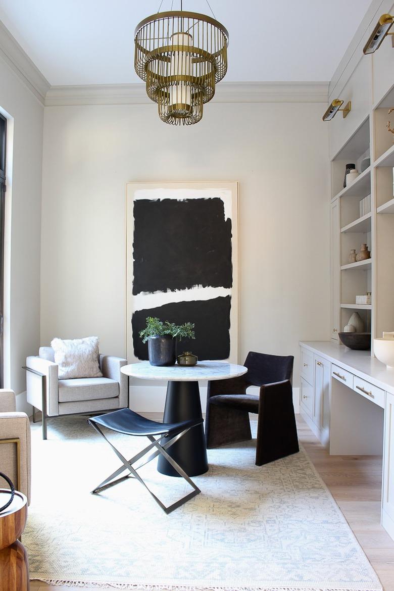 tiered minimalist chandelier in modern black and white office