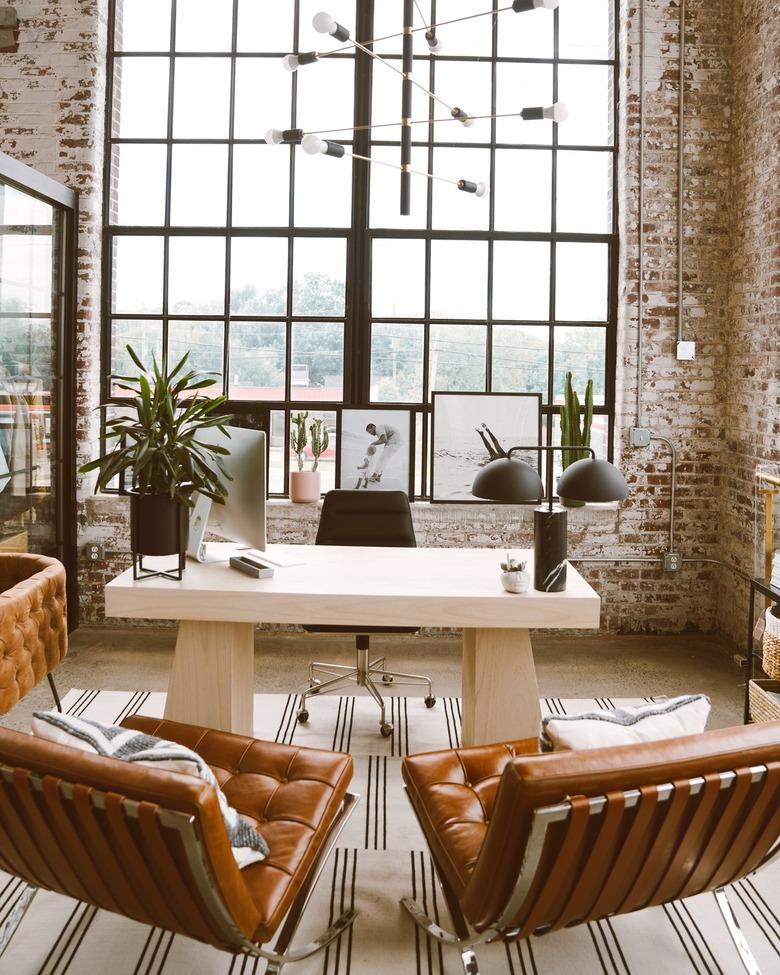 black and brass sputnik chandelier in modern industrial office