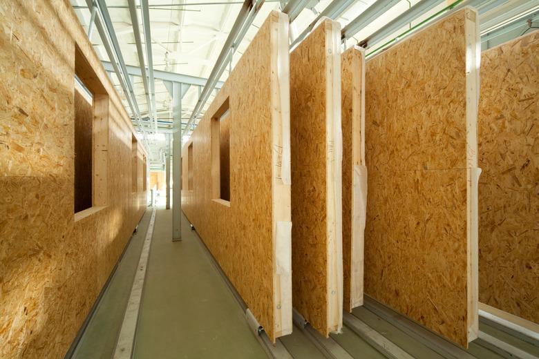 Fiberboard walls lined up in a factory lumber yard