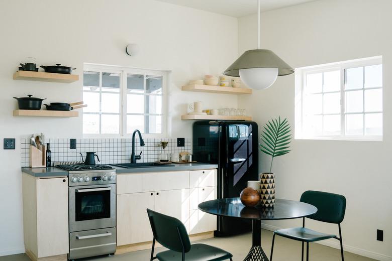 small kitchen with black refrigerator