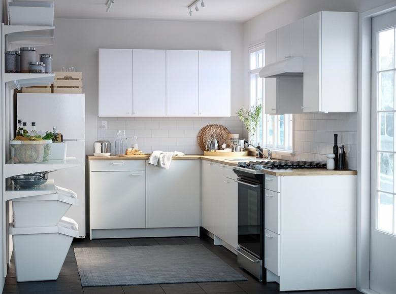 kitchen space with white cabinets