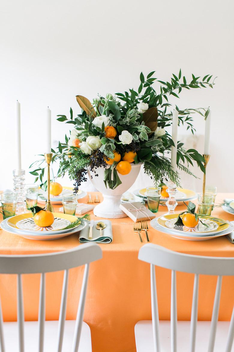 orange table with citrus arrangement for Christmas centerpiece