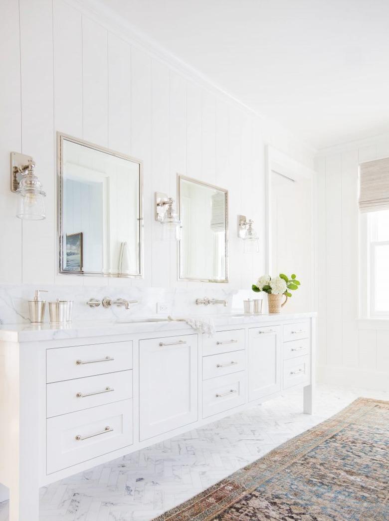 Bathroom designed by Amber Interiors with chrome faucet