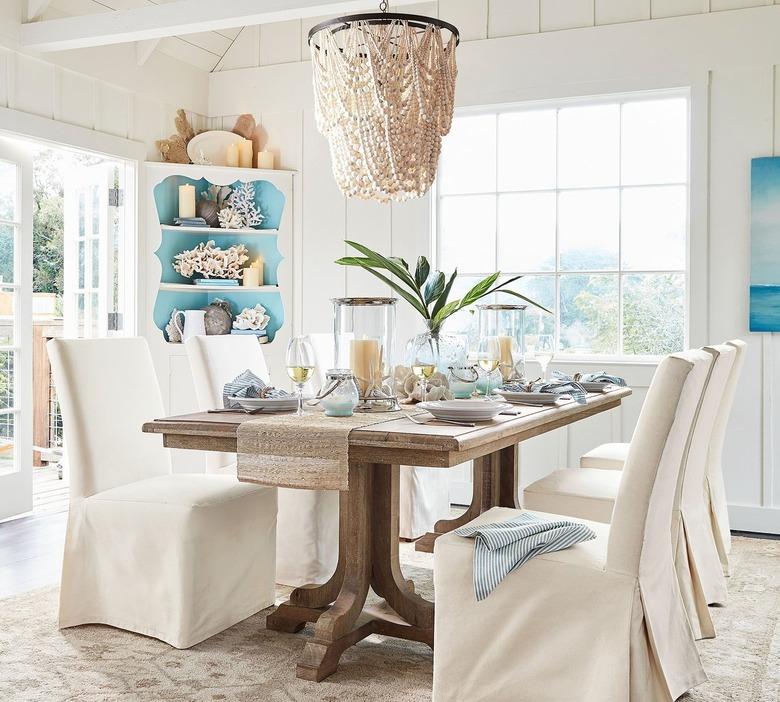 coastal dining room lighting with Pottery Barn Amelia wood bead chandelier