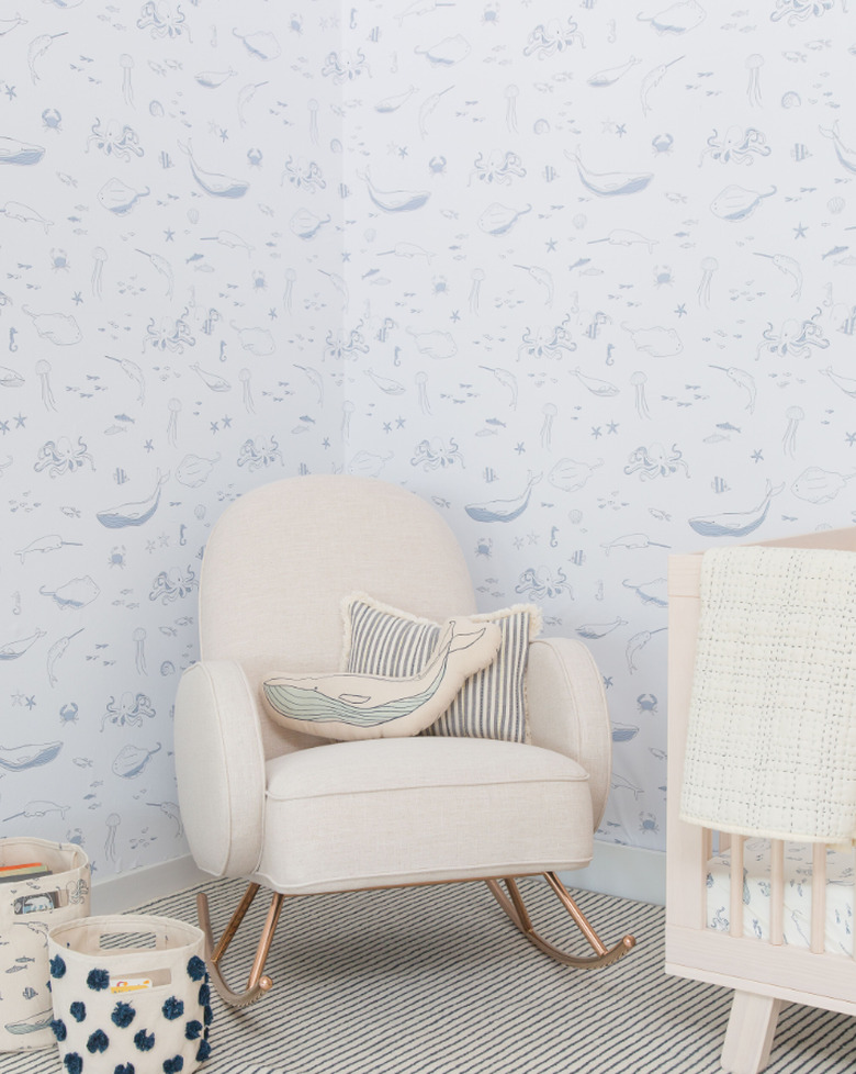 gender neutral nursery with sea mammal coastal wallpaper