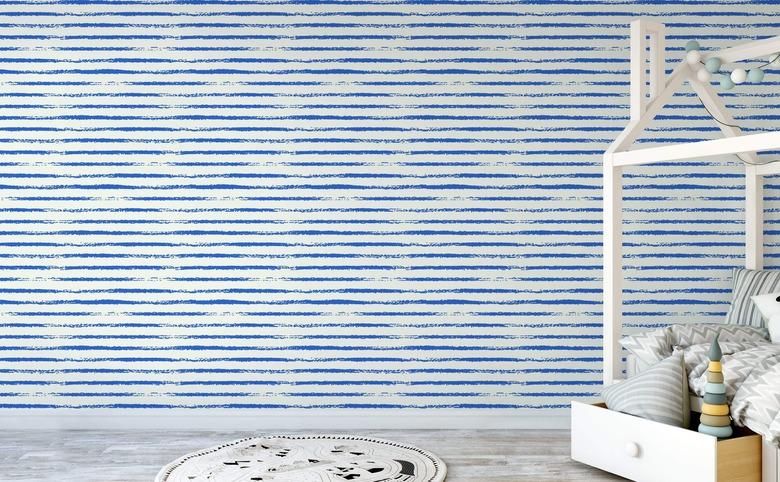 blue and white stripe coastal wallpaper in kids bedroom