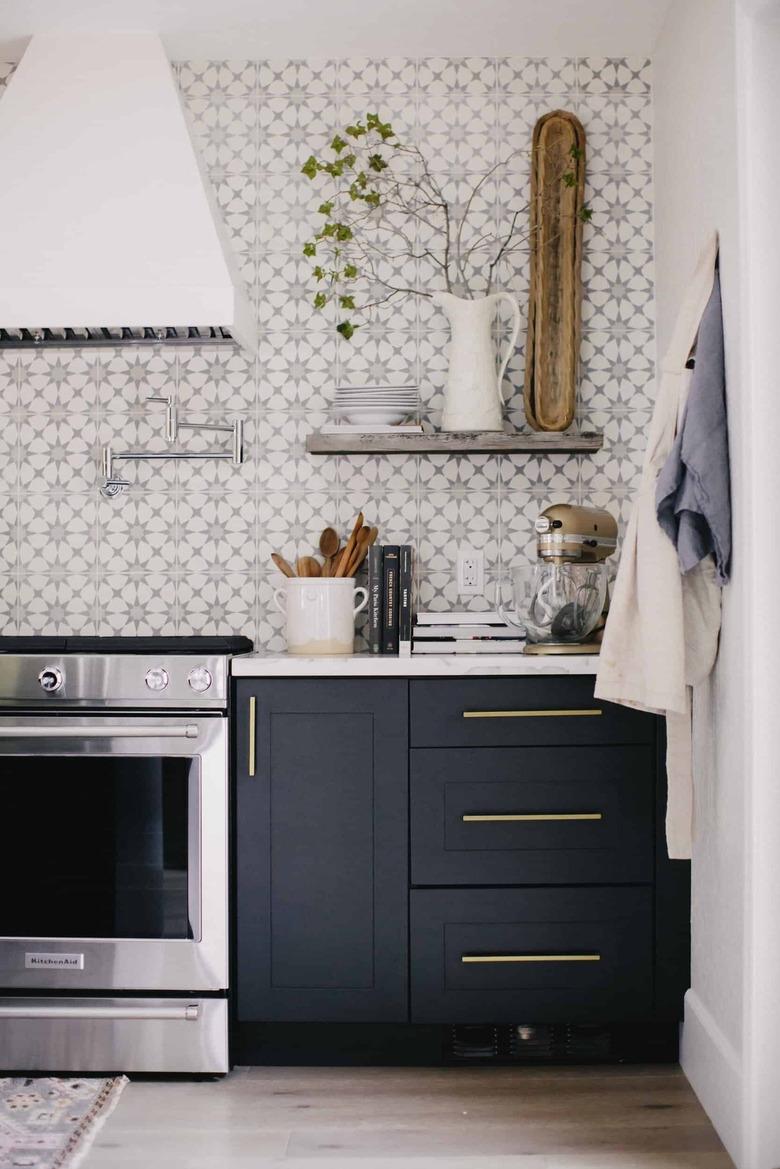 Navy blue kitchen cabinets  with stone countertops