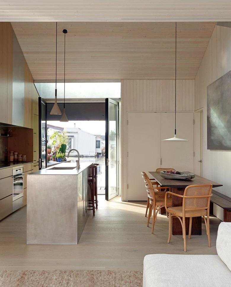 Beige kitchen with pewter island.